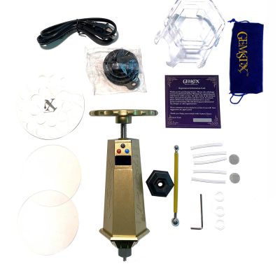 Overhead view of the full GEMSTX kit including the manual press, power cables, filters, tools, and carrying pouch.